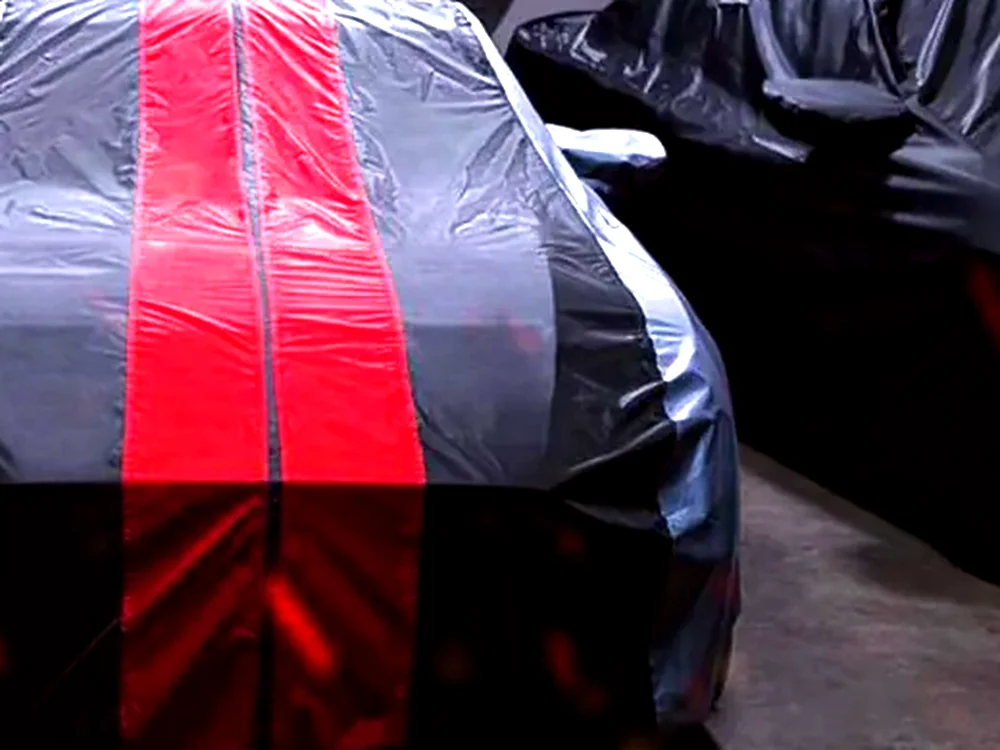 A vehicle-specific Coverland car cover fitted to a car.